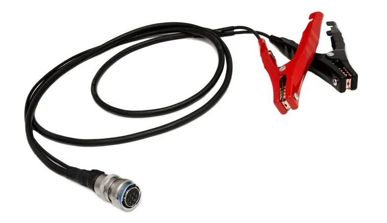 A black two-conductor lead with a red and a black battery clamp at one end and a round steel multi-pin connector at the other